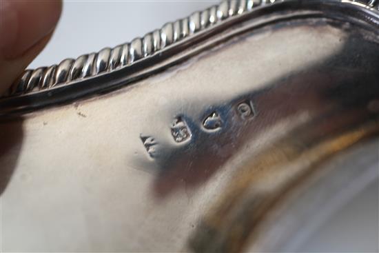 A pair of George III silver pedestal sauceboats by William Skeen, 29.5 oz.